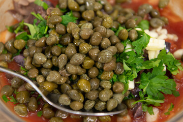 Capers in a bowl. Capparis spinosa, caper bush or Flinders rose.
