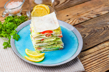 Sandwich with salmon, curd cheese and vegetables on the wooden background and with copy space