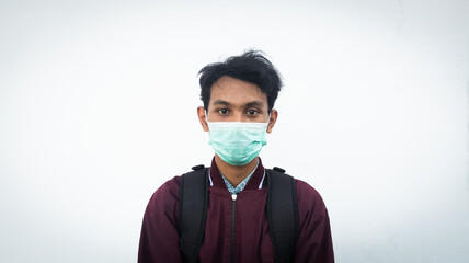 asian man wearing mask during pandemic