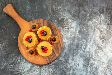 Horizontal view of stack of yummy pancakes for breakfast on cutting board