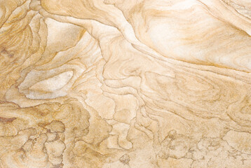 Texture beige d'une pierre formée de sable concassé. Très abstrait, parfait pour un fond d'écran ou une illustration d'arrière-plan.