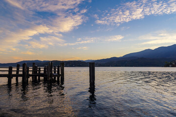 Obraz premium Wooden pier on lake Orta, Piedmont, Italy