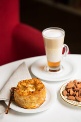 Latte in tall glass and desserts