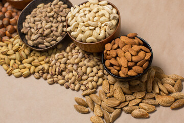 Different types of nuts in composition on white background in studio