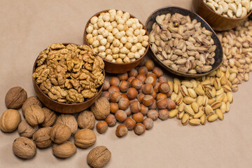 Different types of nuts in composition on white background in studio