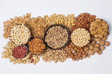 Different types of nuts in composition on white background in studio