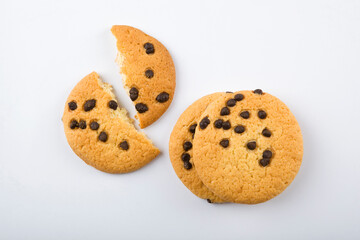 Delicious cookies with chocolate chips on a colored background