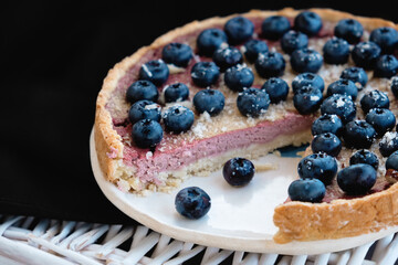 vegan blueberry cake on white handmade ceramic plate