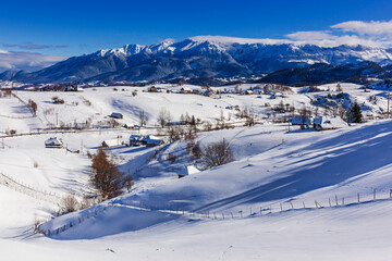 Winter in Pestera Village. Rural landscape in the Carpathians, Romania.