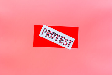 Protest sign concept. Word Protest on paper banner, top view