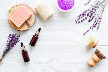 Fototapeta na wymiar Frame of beauty treatment -lavender bath salt and essential oil