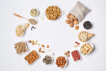 Fototapeta na wymiar Different types of nuts in composition on white background in studio