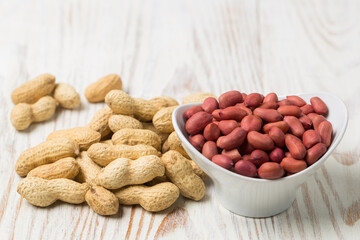 Peanut in a bowl isolated on white