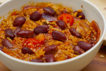 Chili con carne in a white bowl