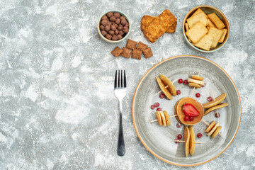 Overhead view of yummy pancakes chocolate cookies biscuits on blue backgound