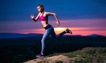 Fitness Woman on Hills at Sunset