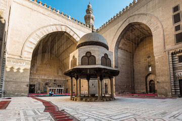 Interiors of the Mosque-Madrassa of Sultan Hassan , massive mosque and madrassa located in the Old city of Cairo, built during the Mamluk Islamic era in Egypt. - obrazy, fototapety, plakaty