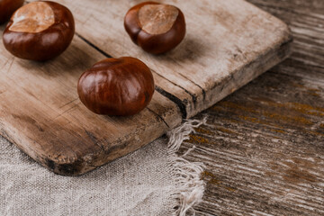Chestnuts on an old wooden table