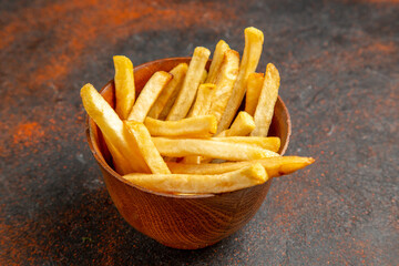 Close up view of french fried potato in a brown bowl
