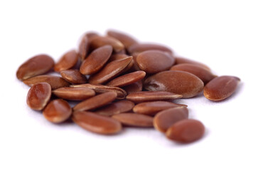 Close-up of flax seeds isolated on white background