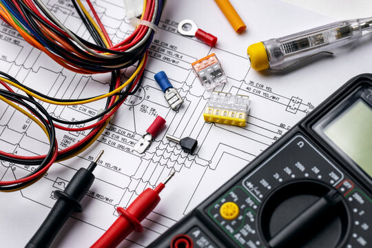 electrician tools and electrical equipment on wiring diagram