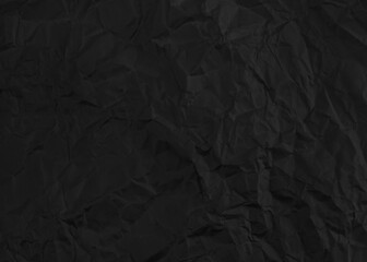 Black crumpled paper texture background.