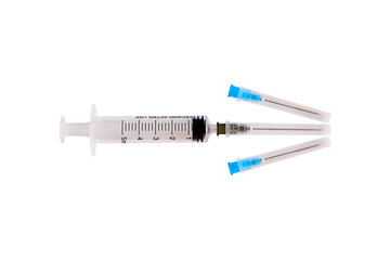 Fototapeta premium Medical syringe needle laid out in the form of an arrow isolated on white