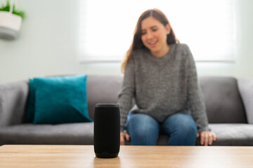 Woman giving a command to a smart device