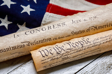 US Constitution and Declaration of Independence on the American Flag - 399552674