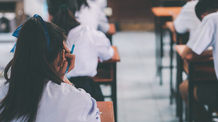 Students taking exam with stress in school classroom.16:9 style