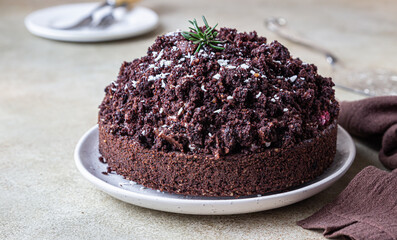 Homemade chocolate cake with cherry and whipped cream. Cake Mink mole or Mole hole cake.