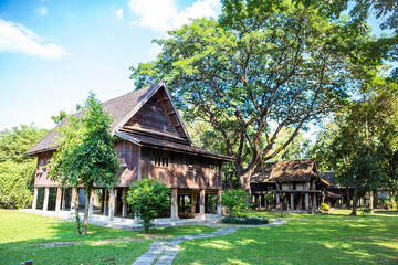 Traditional Thai style wooden house surrounded with nature, summer outdoor day light, Thai hosue museum in Norther of Thailand