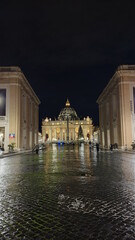 VATICAN CITY, ITALY - APRIL 10, 2020: motion blur of ancient st peters basilica at night