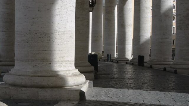 Portico with huge white marble columns of Cathedral of San Pietro in Rome without visitors &ndash; Realtime in 4K