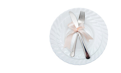 White plate, fork and knife on white background.