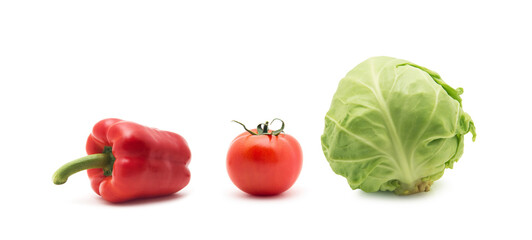 whole green cabbage, tomato and sweet pepper isolated on white