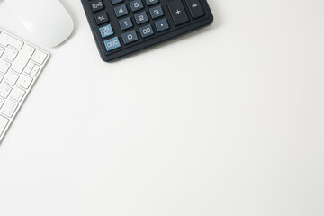 Office workplace with keyboard mouse and calculator