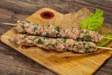 Raw minced pork skewer kebab for grill