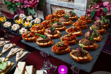 Сatering. Banquet table with different snacks and desserts