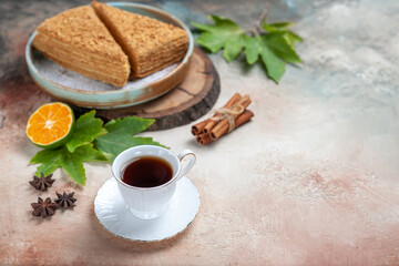 front view yummy honey cake with cup of tea on light background cake sweet biscuit