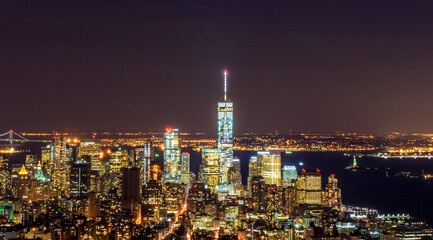 Fototapeta na wymiar Breathtaking Panoramic and Aerial View of Manhattan, New York City at Night. Beautiful, Illuminated, Futuristic Buildings. Freedom Tower, Lady Liberty