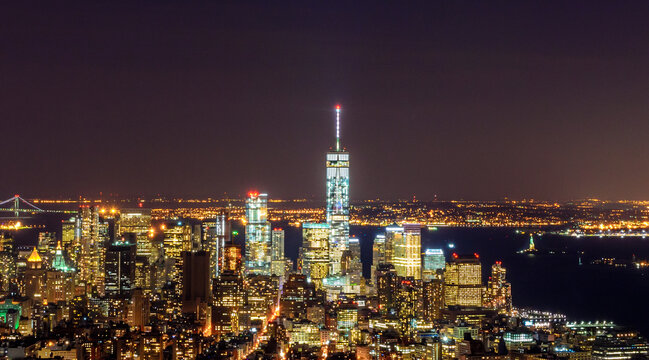 Breathtaking Panoramic and Aerial View of Manhattan, New York City at Night. Beautiful, Illuminated, Futuristic Buildings. Freedom Tower, Lady Liberty
