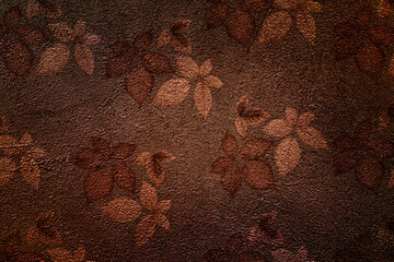 Old brown background texture with autumn leaves of blackberry. Brown pattern with leaves. Plaster cement.