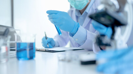 Scientists work in lab, Researcher conduct experiment analyzing drug treatment..