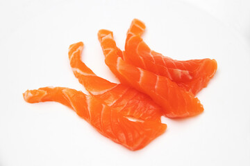 Fresh salmon fillet piece on isolated white background.