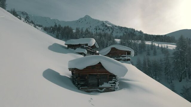 Untouched snow at mountain huts in the Alps.