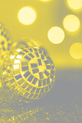 Close-up Crystal ball Decorated on Christmas night on a shiny background and lights. Visualization trendy colors of year 2021 - Gray and Yellow.