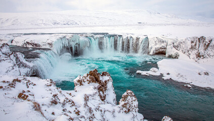 iceland waterfall in winter 
