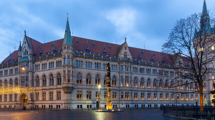 Fototapeta na wymiar Medieval government building illuminated in Braunschweig winter night