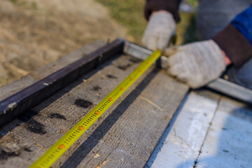 Measurement of length by means of a tape measure, measurement of length of a metal profile.